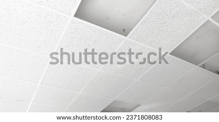 Suspended ceiling installation. Empty frame on plasterboard ceiling