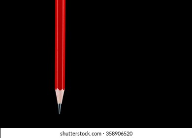 A Suspended HB Pencil Isolated Against A Black Background