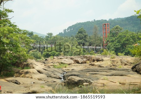 Suspension bridge across chalakkuday river in Kerala, India