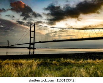 Suspension bridge with beautiful sky colours at sunrise.