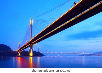Suspension bridge in Hong Kong at night - Shutterstock ID 256701409