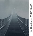 suspension bridge into the fog