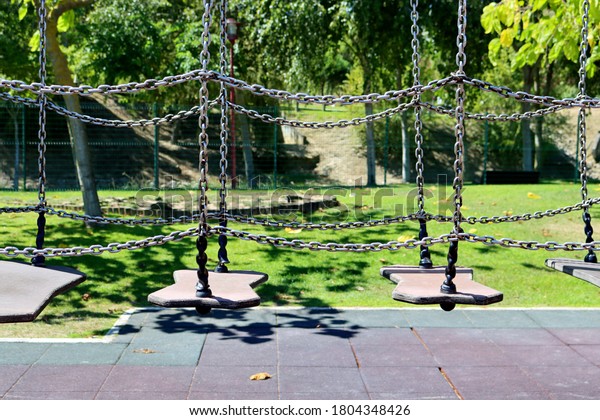 Suspension\
bridge on chains to develop balance and equilibrium in children.\
Children\'s play complex in the fresh\
air.