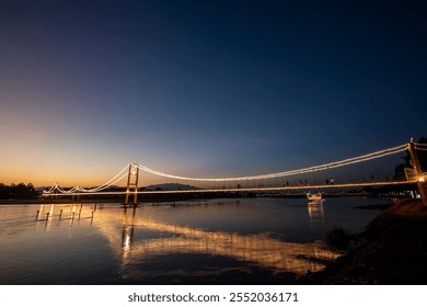 Suspension bridge over the Ping River in Tak Province, Thailand.
 - Powered by Shutterstock