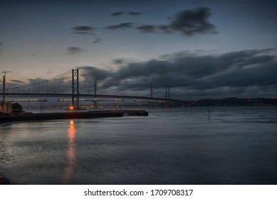 suspension bridge over a river under construction