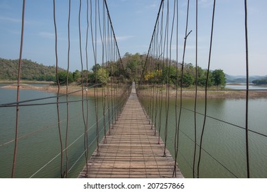 Suspension bridge that leads to the other side of the river.
