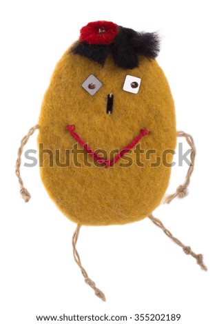 Suspension of felted wool in the form of a cheerful man on a white background