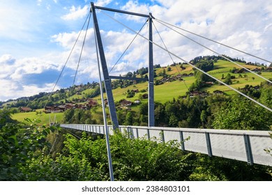 Suspension pedestrian panorama bridge over the Gummi gorge in Sigriswil, Switzerland - Powered by Shutterstock