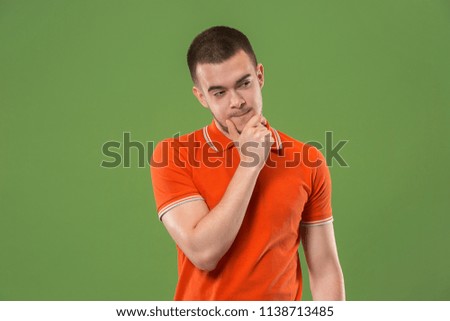 Suspicion. Doubt, mistrust, distrust concept. Doubtful man looking with disbelief expression . Young emotional man. Human emotions, facial expression concept. Studio
