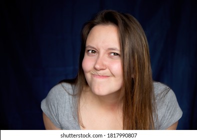 Suspicious Annoyed Young Caucasian Woman With Distrustful Face Looking At Camera, Skeptical Sarcastic Female Feeling Cautious Dubious Distrusting On Dark Background