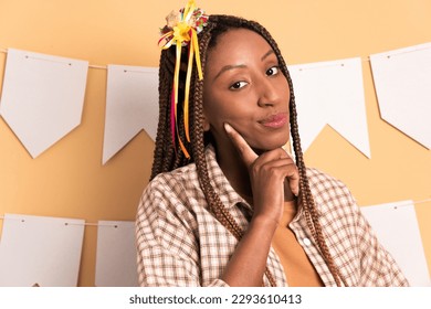 suspicious black young woman to Brazilian Festa Junina in all beige colors. portrait, real people concept. - Shutterstock ID 2293610413