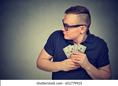 Suspicious Greedy Man Grabbing Money 