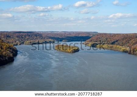 Susquehanna River on a hazy fall morning. It is a major river in the northeastern US. At 444 miles long, it is the longest river in the East that drains into the Chesapeake Bay and Atlantic Ocean. 