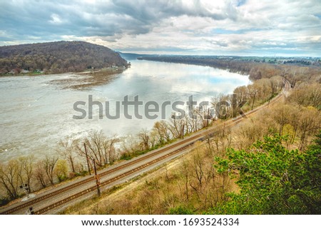 Susquehanna river, railroad, mountain, scenic view from Chickies Rock Overlook, cloudy blue skies, mid day, April, Pennsylvania