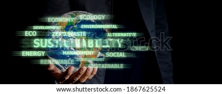 Sustainability development concept, Human hand holding earth on black background and text motion. Elements of this image furnished by NASA