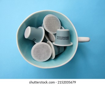Sustainable eco friendly coffee capsules in ceramic cup. The pods are compostable and biodegradable.	
