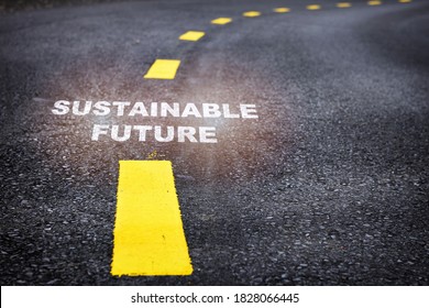 Sustainable future word on asphalt road surface with marking lines. Inspiration and motivation concept and effort idea