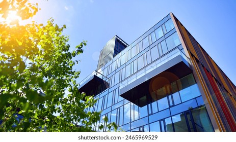 Sustainable glass office building with trees for reducing carbon dioxide. Eco-friendly building in modern city. Office with green environment. Corporate building reduce CO2. - Powered by Shutterstock