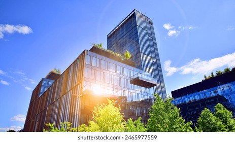 Sustainable glass office building with trees for reducing carbon dioxide. Eco-friendly building in modern city. Office with green environment. Corporate building reduce CO2. - Powered by Shutterstock