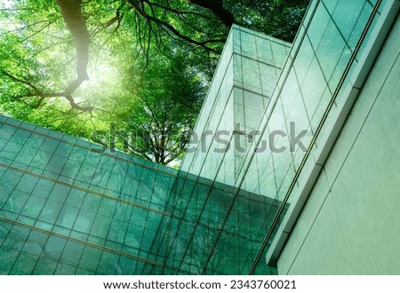 Similar – Image, Stock Photo Sustainble green building. Eco-friendly building in modern city. Sustainable glass office building with tree for reducing carbon dioxide. Office with green environment. Corporate building reduce CO2.