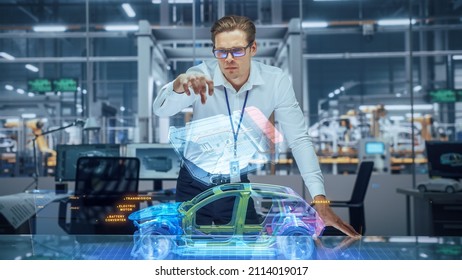 Sustainable Industrial Design: Portrait Of Modern Automotive Engineer Using Augmented Reality To Construct 3D Hologram Model Of High-Tech Electric Car. Automated Vehicle Manufacturing Facility