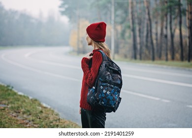 Sustainable Tourism, Responsible Travel. Young Woman Traveler With Backpack In Pine Forest Background.