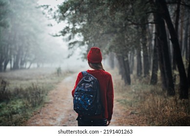 Sustainable Tourism, Responsible Travel. Young Woman Traveler With Backpack In Pine Forest Background.