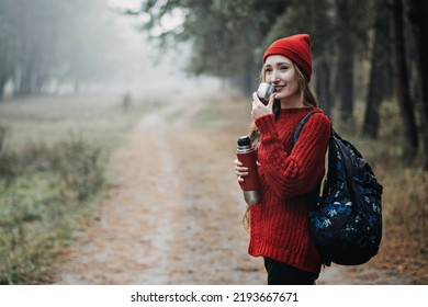 Sustainable Tourism, Responsible Travel. Young Woman Traveler With Backpack Holding Tremors Zero Waste Cup