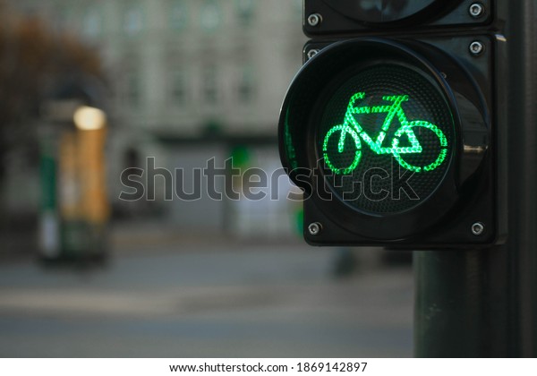 Sustainable transport.\
Bicycle traffic signal, green light, road bike, free bike zone or\
area, bike sharing