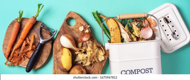 Sustainable and zero waste living. Vegetable waste in recycling compost pot. top view. Copy space. Peeled vegetables on chopping board, white compost bin on blue background. Recycle kitchen waste. - Powered by Shutterstock