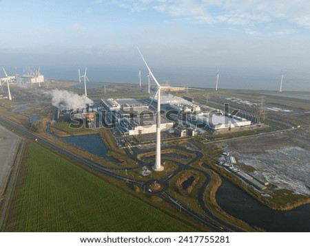 SustainableClimateVisuals Datacenter using sustainable energy produced by wind turbines. Eemshaven, The Netherlands. Aerial drone view.