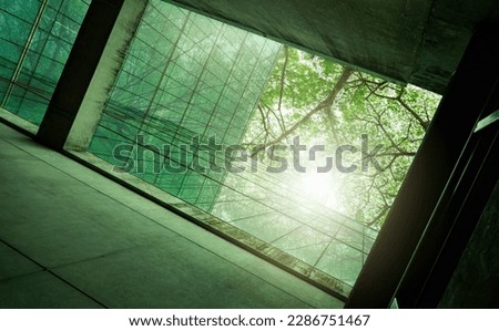 Similar – Image, Stock Photo Sustainble green building. Eco-friendly building in modern city. Sustainable glass office building with tree for reducing carbon dioxide. Office with green environment. Corporate building reduce CO2.