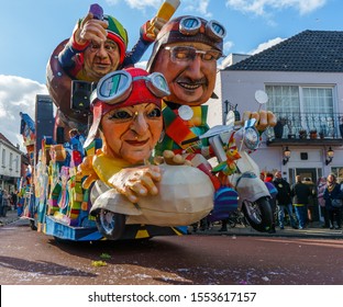 Susteren, Limburg/ The Netherlands - March 5 2019: A Large Carnival Car With Three Figures In A Motorcycle With A Sidecar Takes A Turn During The Limburg Carnaval Car Championship.