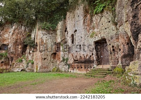 Sutri, Viterbo, Lazio, Italy: facade of the Mitreo, ancient rock-cut church of the Madonna del Parto, developed out of a mithraeum, pagan cult site, in Etruscan archaeological site

