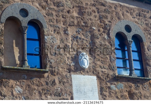Sutri,Italy-January\
15,2022 : Two-mullioned window,whose space is divided vertically\
into two equal light ,consisting mostly of a small column.Its a\
support for the frame with medieval\
