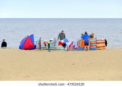 Sutton-on-Sea, Lincolnshire, UK. August 14, 2016. An Extended Family Enjoy A Home From Home On A Overcast Day On The Beach At Sutton-on-Sea.