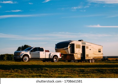 SUV Camper Mobile Camper Trailer In Sunset Light In Iceland In Summer