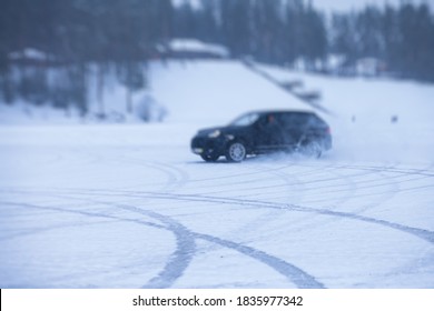 SUV Car Drifting In Snow, During Competition, Sport Car Racing Drift On Snowy Race Track In Winter.