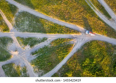 SUV Car With Kayaks On A Roof Navigating Sandy Trails In Nebraska National Forest On A Shore Of Dismal River, Overhead Aerial View