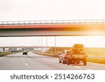 SUV drives with ATV trailer on highway