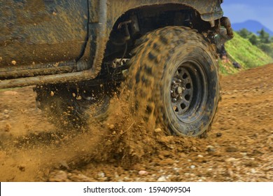 SUV Off Road  4WD Spin Mud Dirty Track On Mountain Hill.