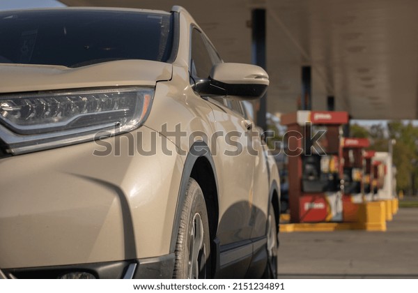 A suv sports\
utility vehicle at a gas\
station