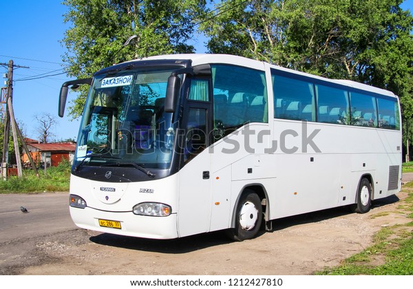 Suzdal, Russia - August 23, 2011: White\
coach bus Irizar Century in the city\
street.