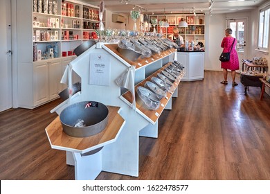 Svaneke, Bornholm Island, Denmark - June 28, 2019. A Female Tourist Making Her Choice In Bolcheriet - Famous Hard Candy Manufacture And Store In Svaneke.