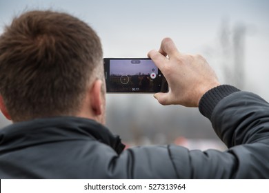 SVETA NEDELJA, CROATIA - NOVEMBER 27, 2016. 7th Rally Show Santa Domenica. Unidentified Man Taking Video With Smart Phone. 