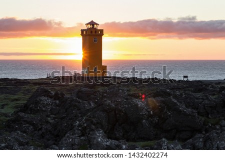 Svortuloft Lighthouse, Hellissandur in The Snaefellsjokull National Park, Snaefellsbaer, Iceland. Orange colorful sunset, good sunny weather.