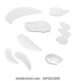 Swabs of creamy textures. Strokes of body lotion or hand cream in different shapes and sizes. Smear of skincare cosmetics product. Cosmetology wellness and beauty concept. Isolated on white