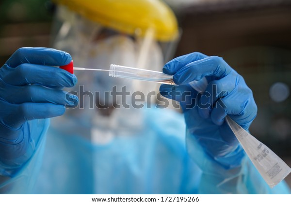 \
Swabs test,Doctors in protective clothing\
performed a nasal mouth swabs congestion. From the patient to test\
for Coronavirus Covid-19\
infection.