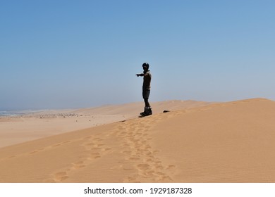 Swakopmund, Namibia – March 04, 2021: Sandboarding Near Swakopmund. 