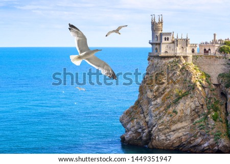 Swallow's Nest at Black Sea, Crimea, Russia. It is landmark of Crimea. Amazing view of castle on mountain top and seagulls. Scenery of nice place in Crimea in summer. Travel, tourism, nature of Crimea
